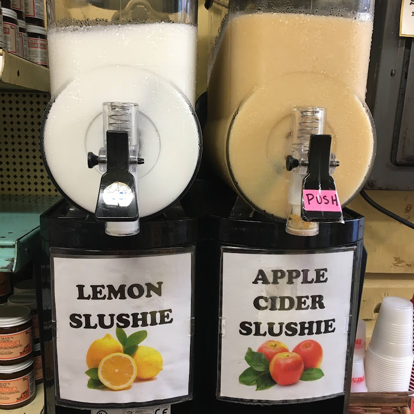 Machine dispensing apple cider and lemonade slushies